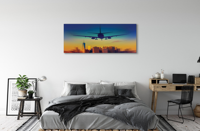 Obraz na płótnie Miasto chmury samolot zachód