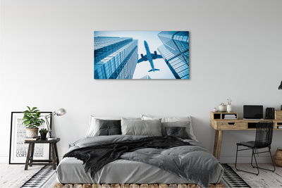 Obraz na płótnie Budynki samolot niebo